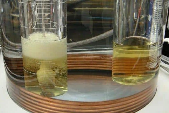 Oil ASTM D5864 and OECD 301B biodegradability testing of lubricants showing laboratory analysis and microbial breakdown of oil in environmental conditions.
