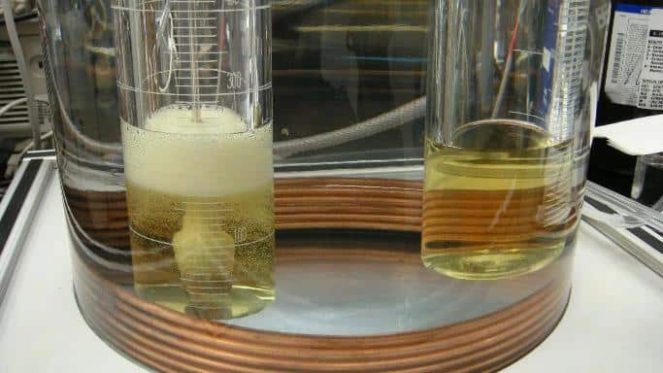 Oil ASTM D5864 and OECD 301B biodegradability testing of lubricants showing laboratory analysis and microbial breakdown of oil in environmental conditions.