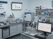 Modern environmental testing lab setup showing specialized apparatus for OECD, ASTM, and ISO biodegradability testing methods.
